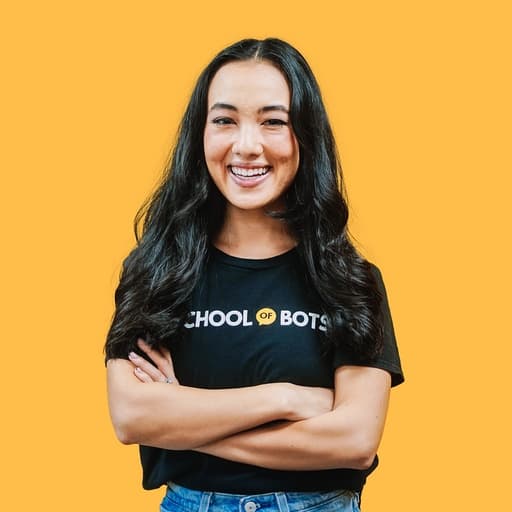 Natasha Willis, arms crossed, in a School of Bots T-shirt